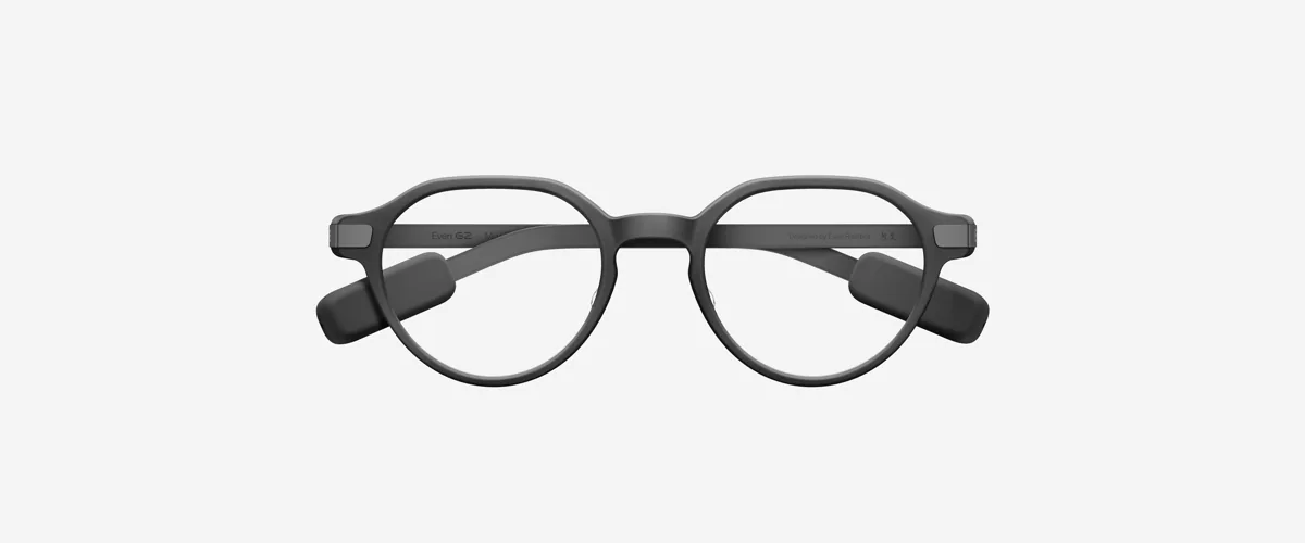 Round-framed everyday eyewear with a display built into the lenses, seen from the front